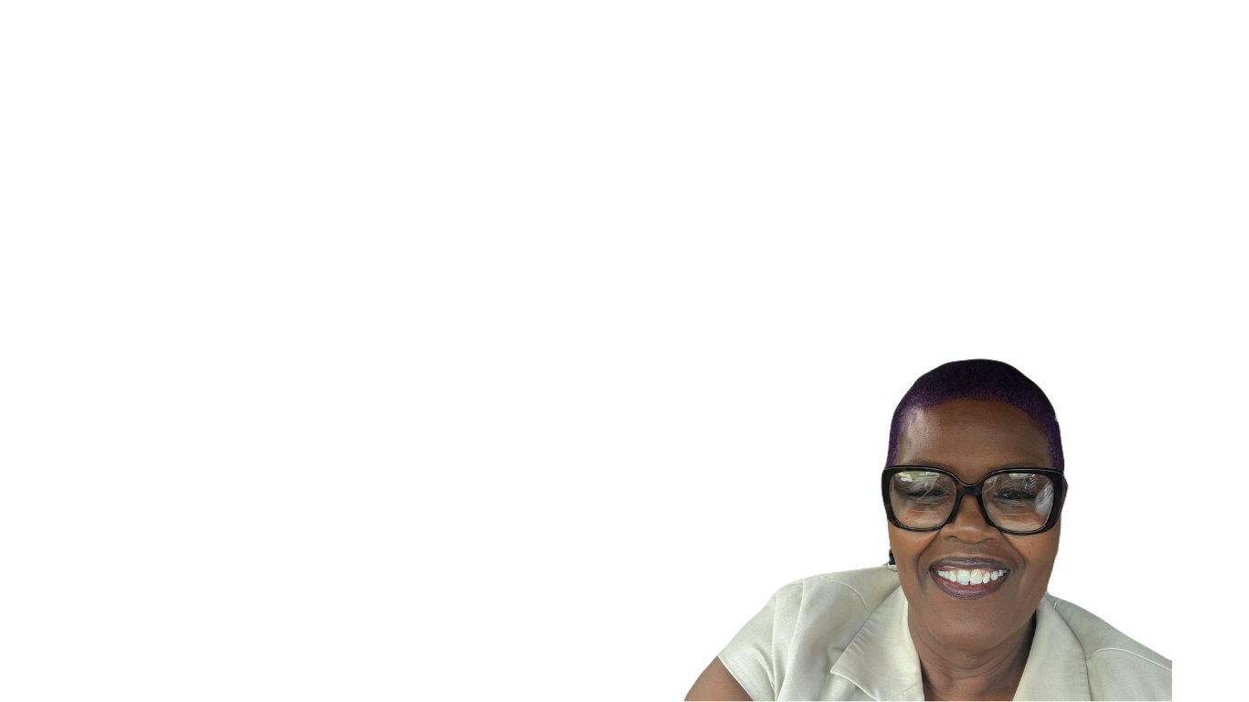 A woman with short hair, wearing glasses and a light-colored blouse, smiling at the camera.