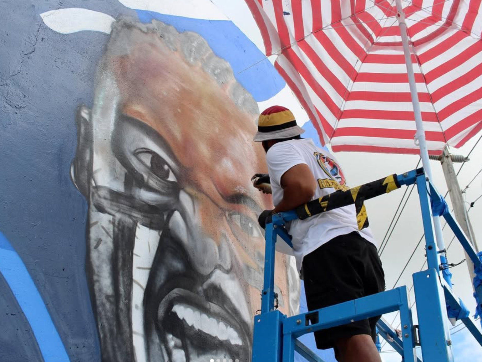 Ktano paiting a portrait of Tua Tagovailoa for the NFL, Paramount Plus and CBS in Wynwood, Miami Florida.