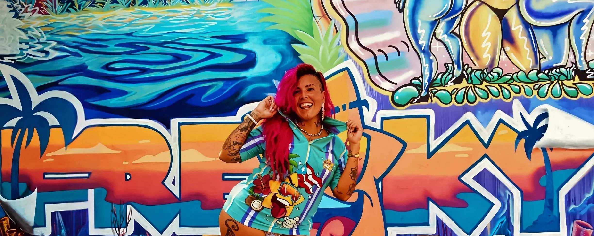 Freaky in front of her mural.
