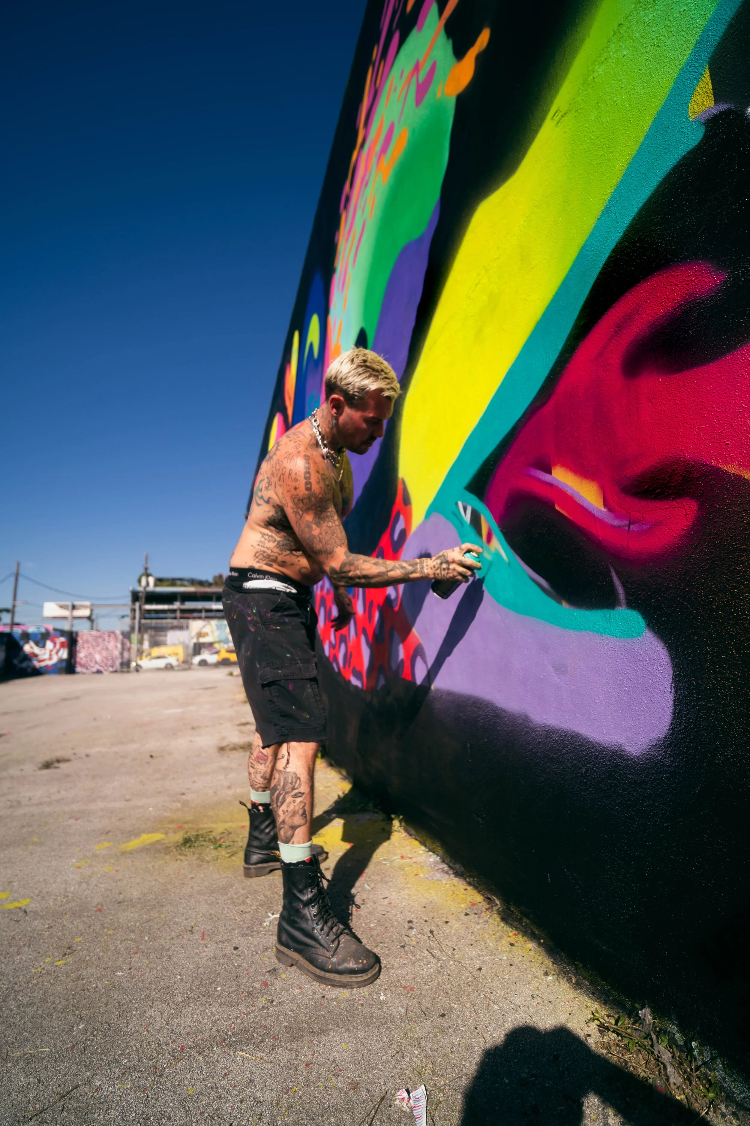Jason Naylor painting at RC Cola Plant during Wynwood Mural Fest 2024.