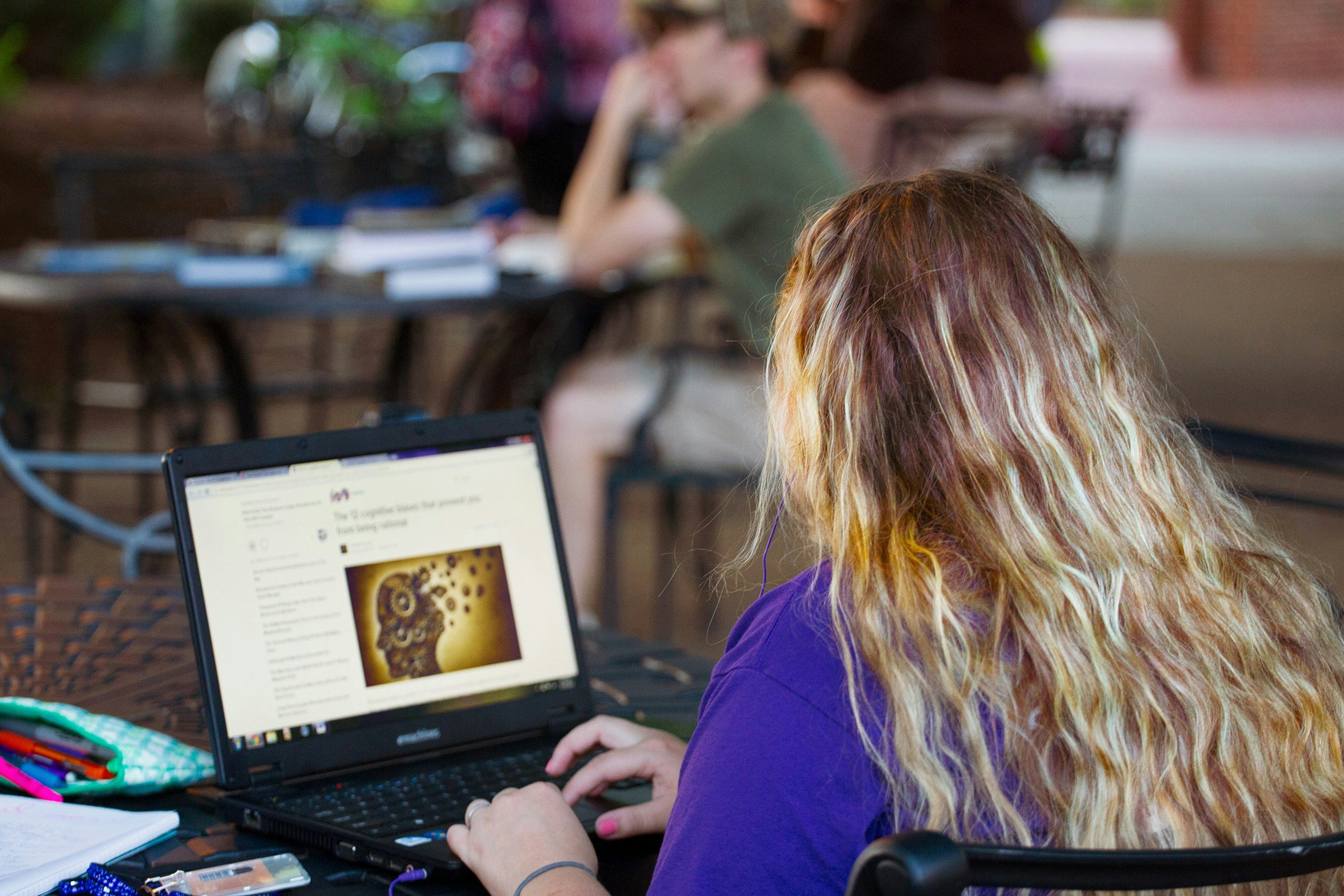 Young woman with computer doing research