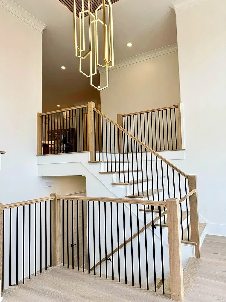 Nearing the finish line at this coastal modern spec. We are loving the details in this show stopping entryway. Warm wood tones &amp; sleek elements make for an inviting and interesting space to welcome guests to your home! ✨
