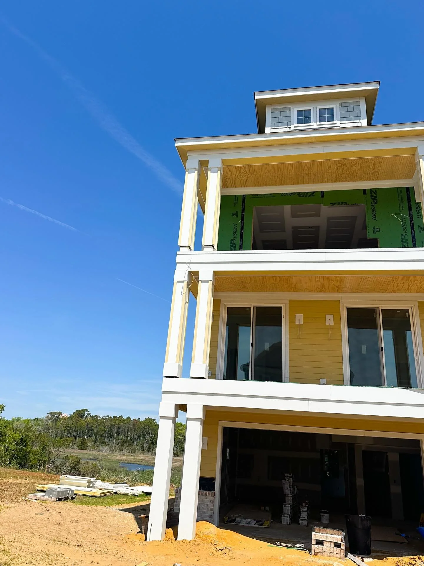 Blue skies at this marsh view spec! Full steam ahead with sheetrock finishing up and selections being made. This home has ample deck space to enjoy the coastal weather ☀️