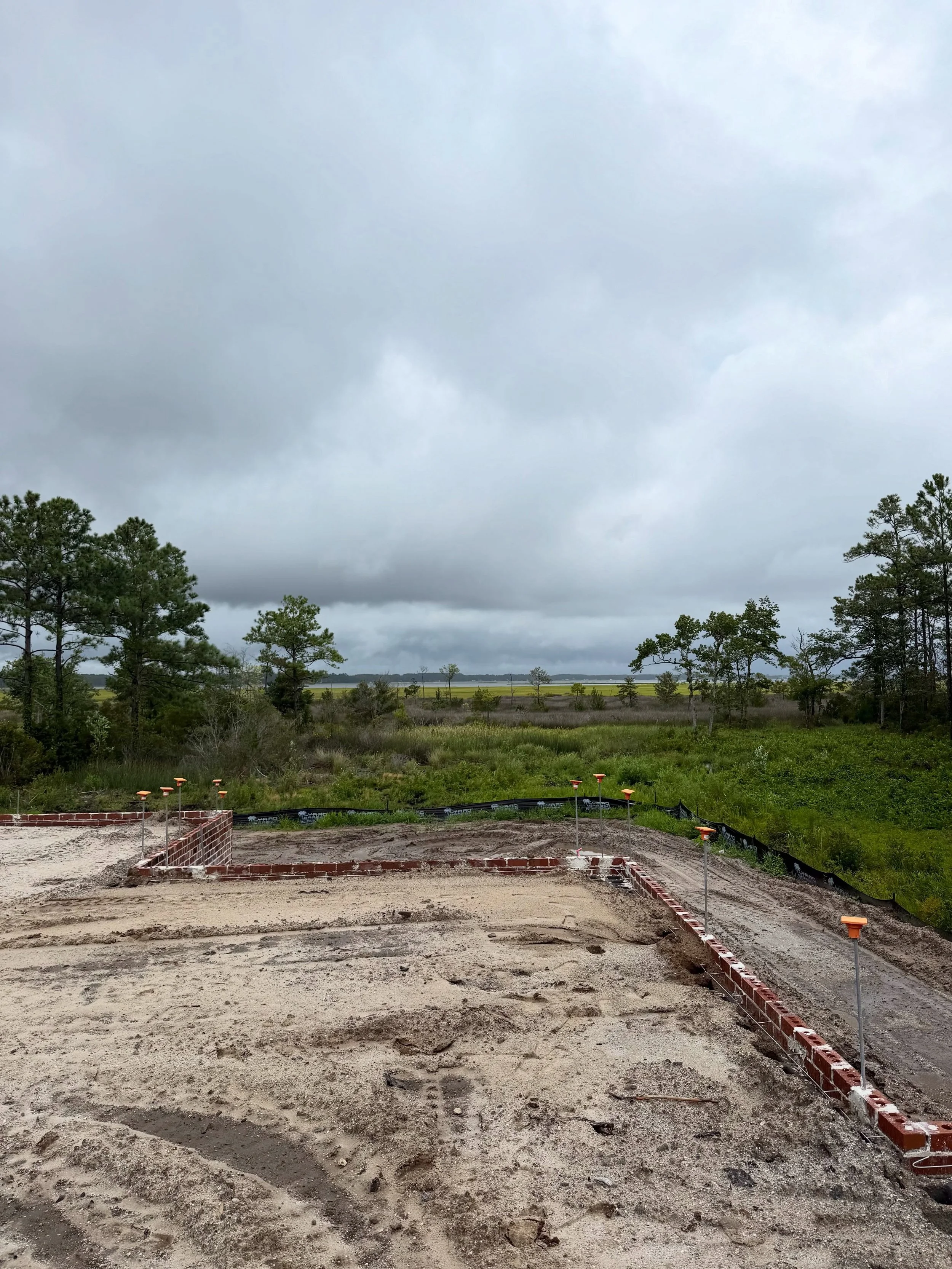 Exciting progress wrapping up the foundation walls and preparing for the slab at this Morehead City custom. This one has been a fun challenge so far with a pile cap footing that took about 90 yards of concrete, 70 8x8 timber piles and a lot of steel 