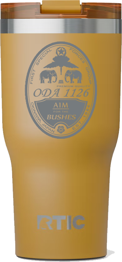 A metal tumbler with a gold finish, featuring a circular emblem with elephants, a star, and text related to the First Special Forces Group, and the phrase 'AIM for the Bushes'.