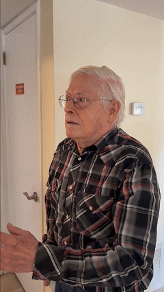 GIF of a white male senior getting the idea to install LED bulbs, then installs one and is satisfied when the light suddenly turns on and he gives a big thumbs up.