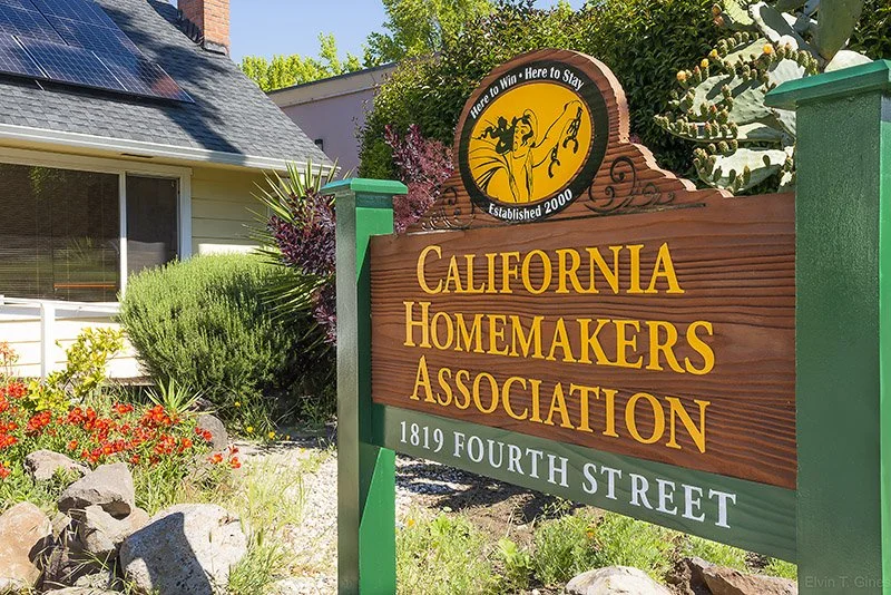 Image of CHA's new front sign with emblem of Paris, name and street address. The right side of the office and solar panels are visible in the background.