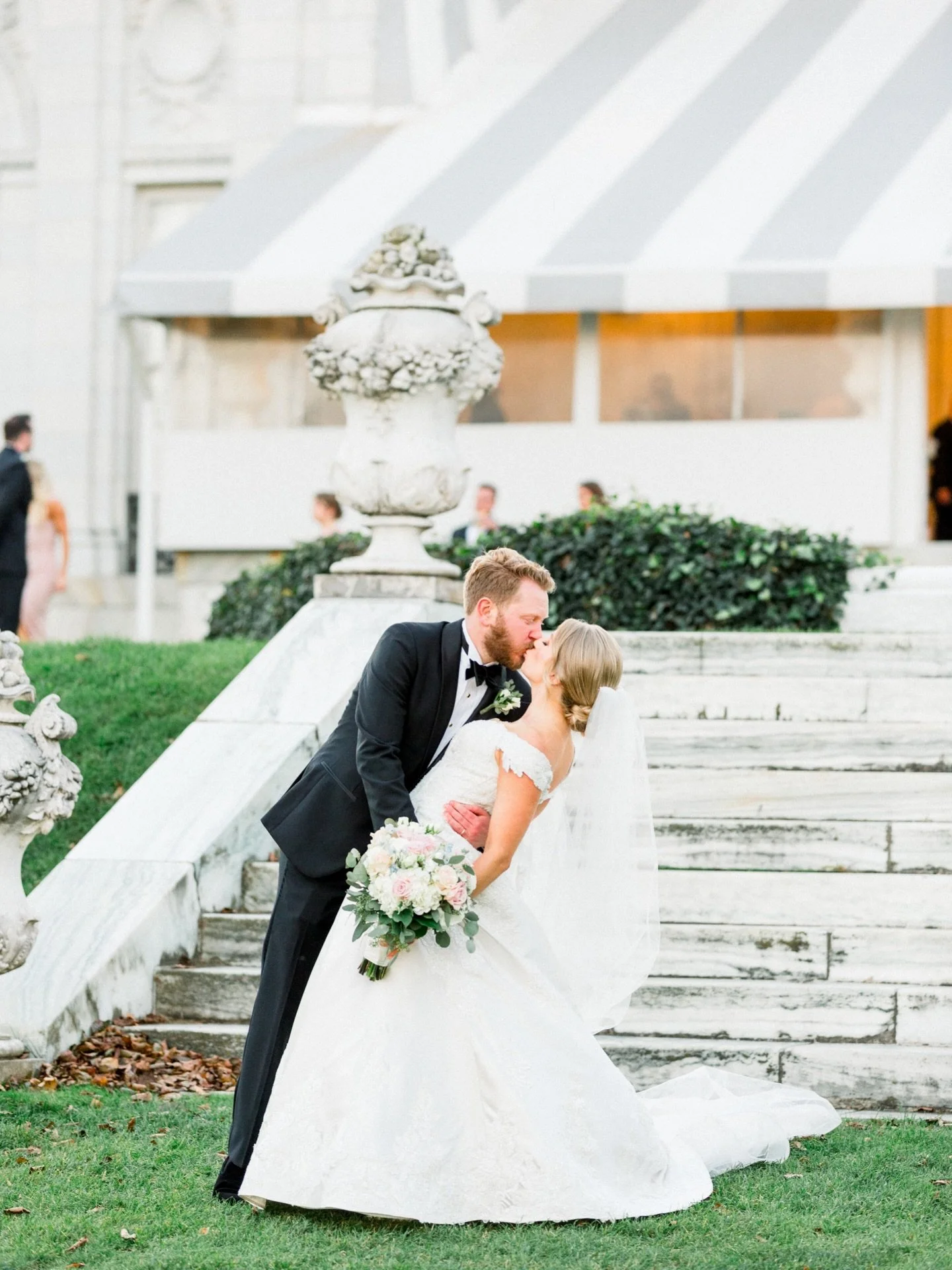Sneaking a kiss during cocktail hour at the iconic Rosecliff @newport.mansions