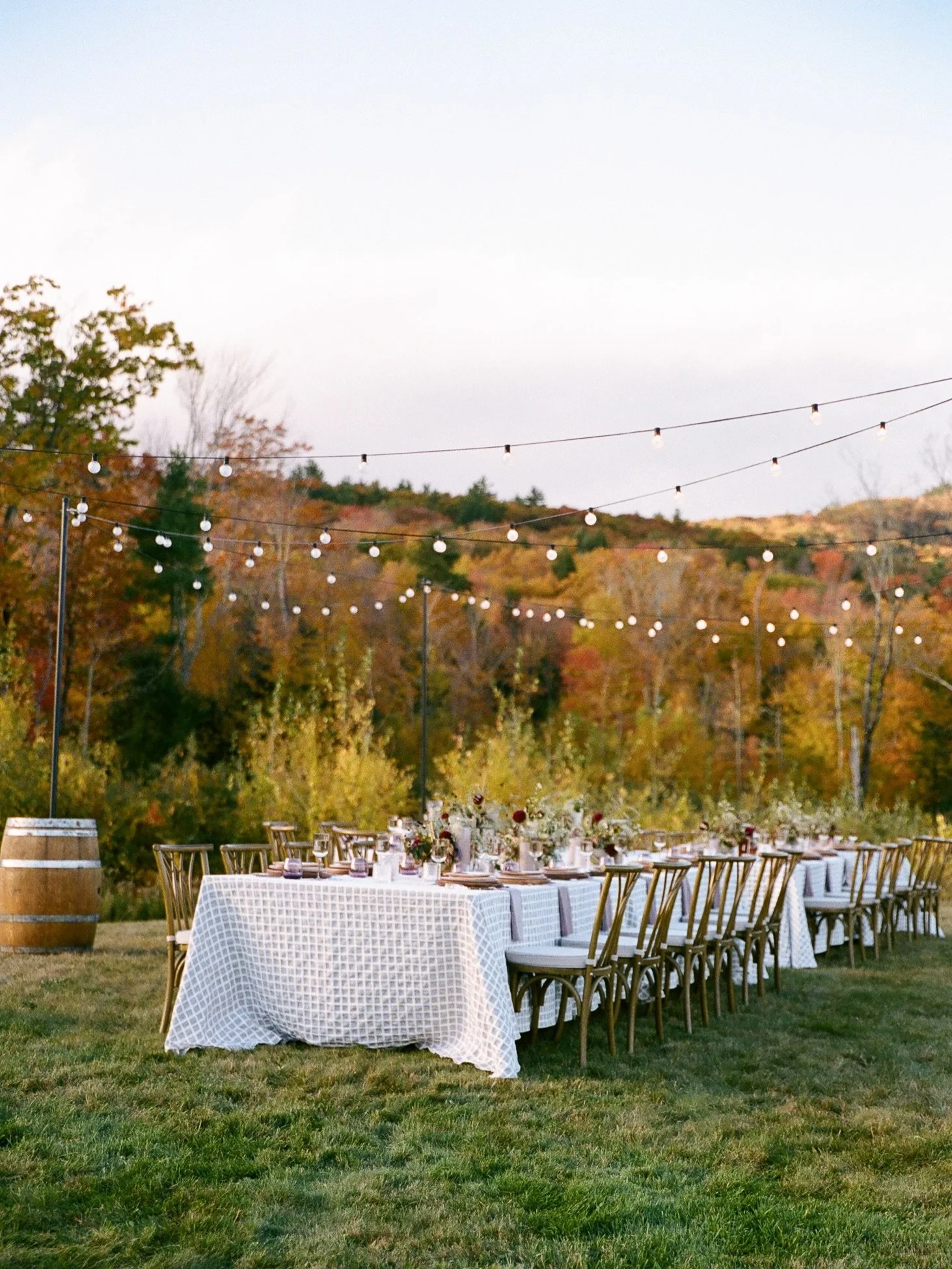 somewhere in the New Hampshire mountains, gathered around a table as the air turns crisp and the light begins to fade. There&rsquo;s something romantic about dining outdoors this time of year, the sort of evening that makes you fall in love with fall
