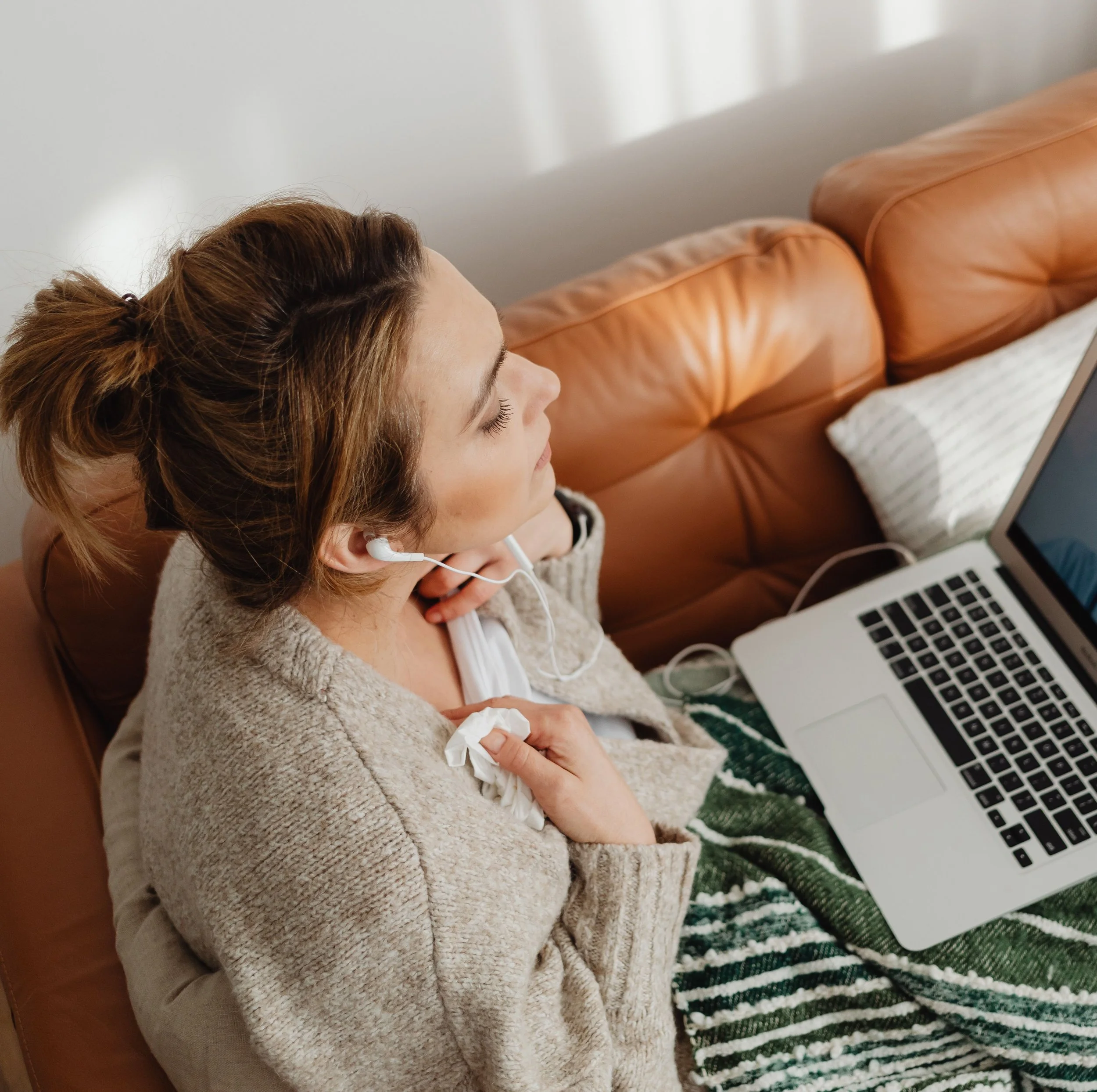 Woman in virtual therapy call at home with A Rising Change