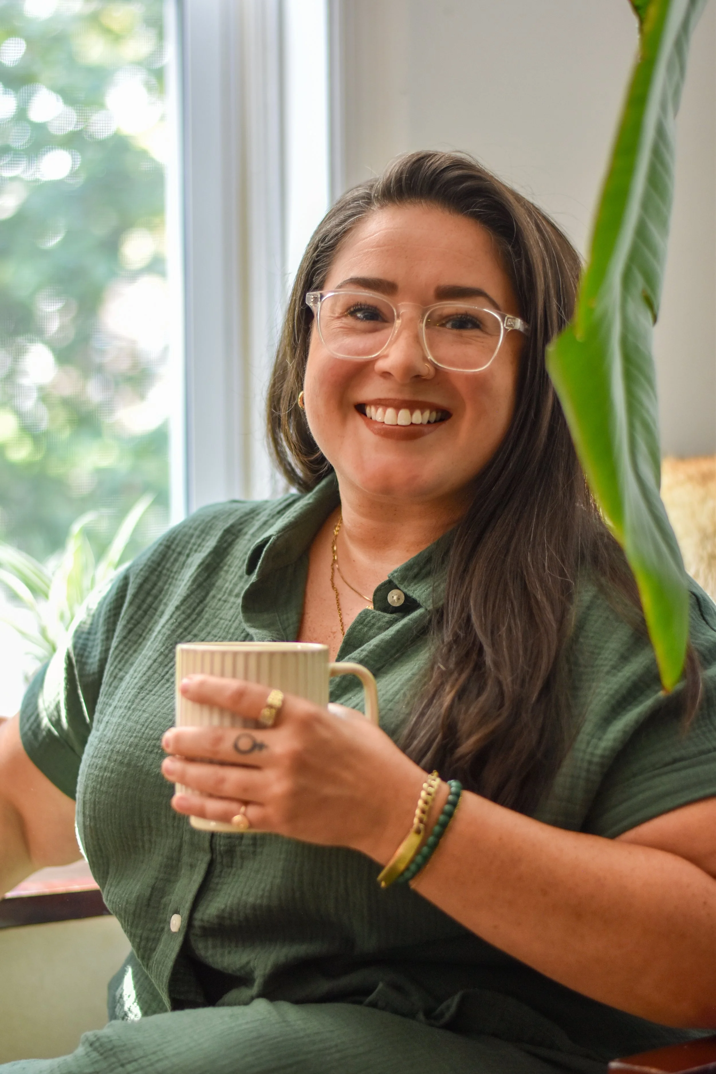 A Rising Change Therapist Savannah sitting in front of a window
