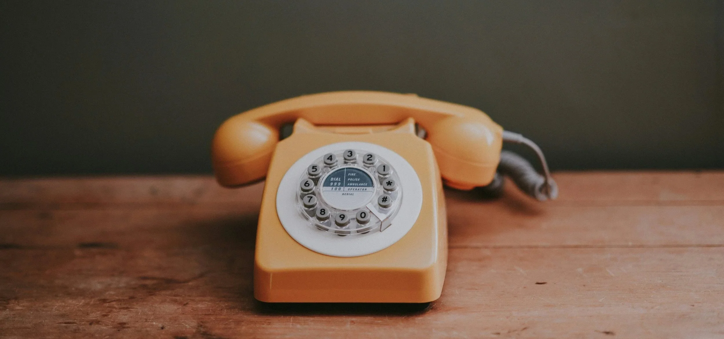 Bright yellow phone on a desk