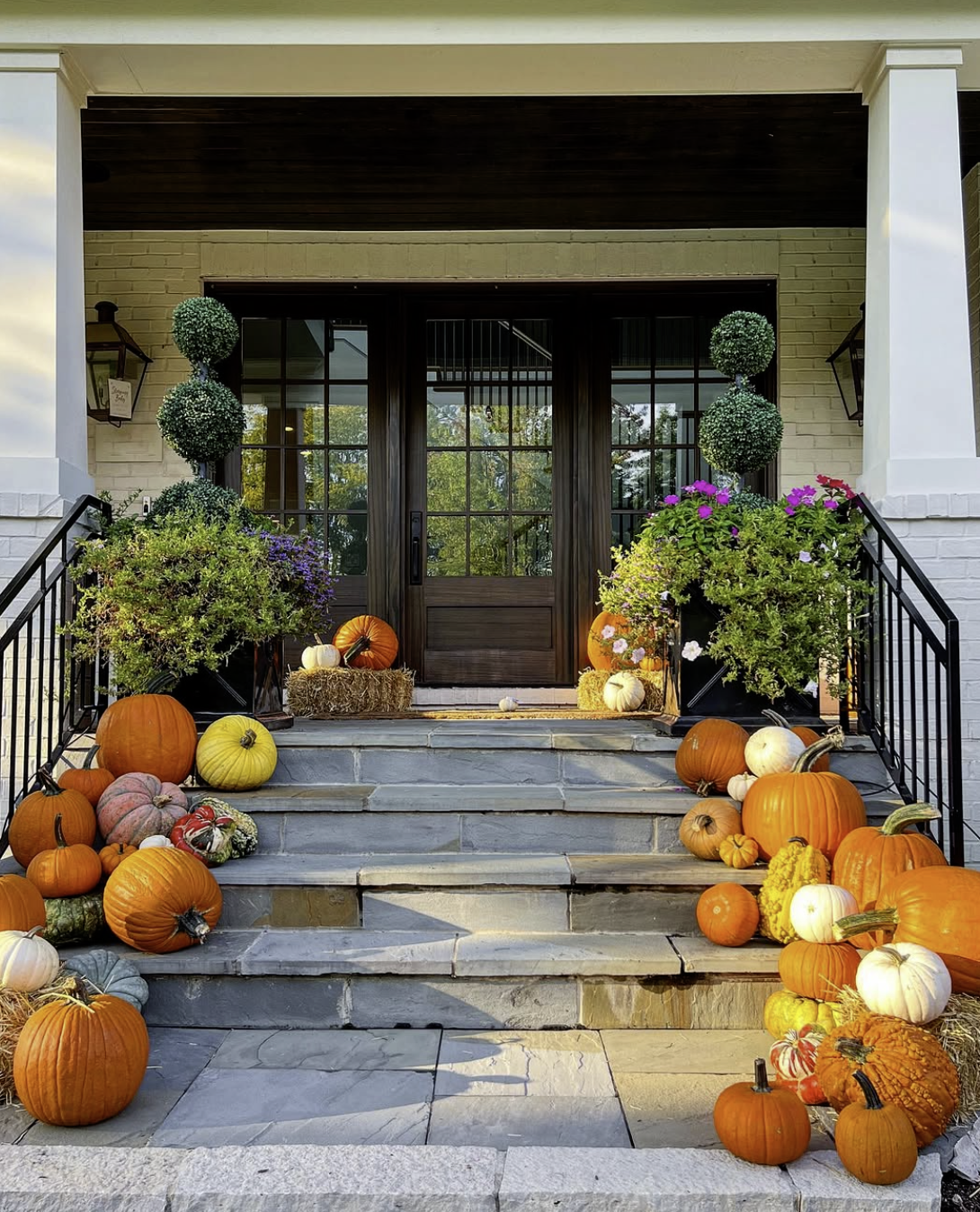 “Fall porch decorating with bright flowers and pumpkins by Patch to Porch in Courtenay”