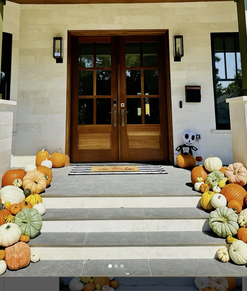“Porch decorated for fall with colorful pumpkins and Halloween accents in Comox Valley”