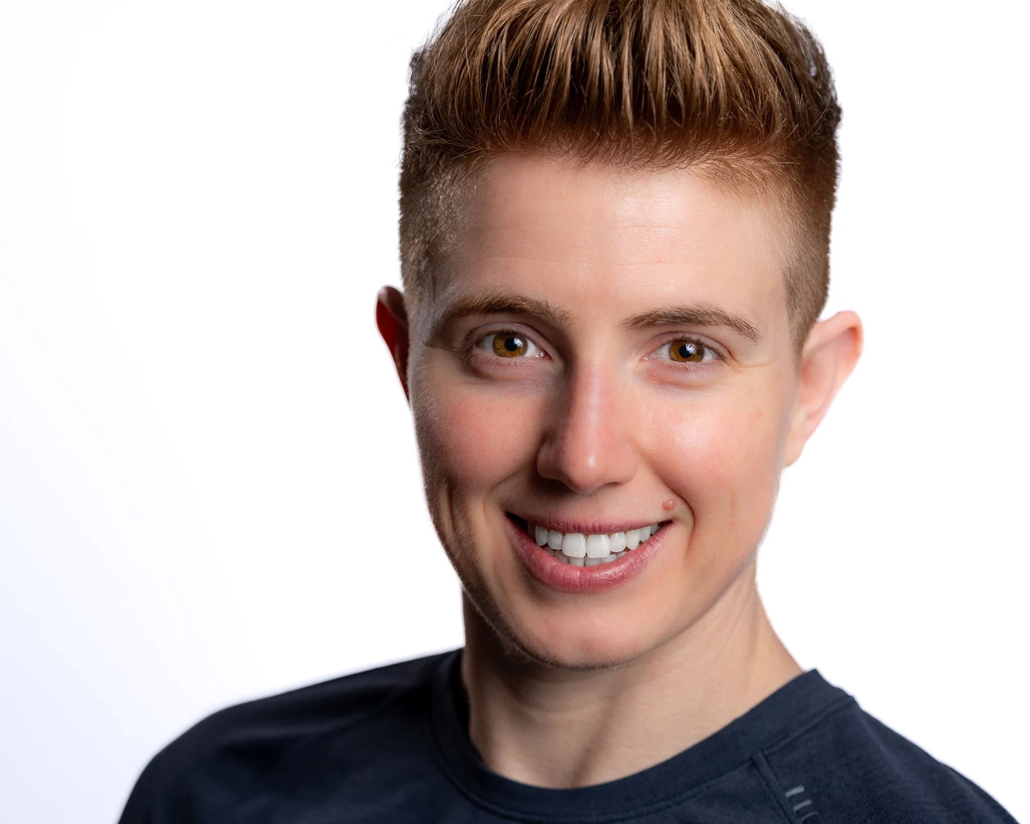 Professional headshot of a woman smiling in studio, Baton Rouge