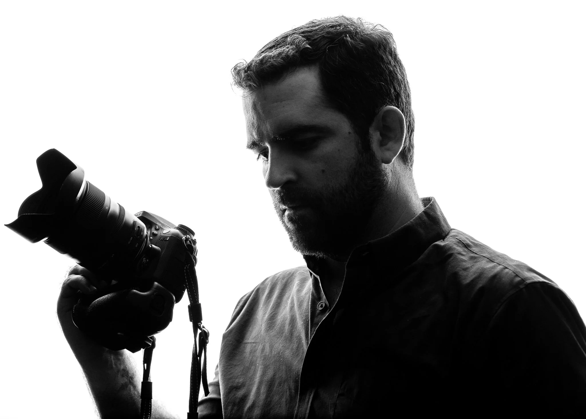 Nick Corripio, Baton Rouge photographer and videographer, holding camera