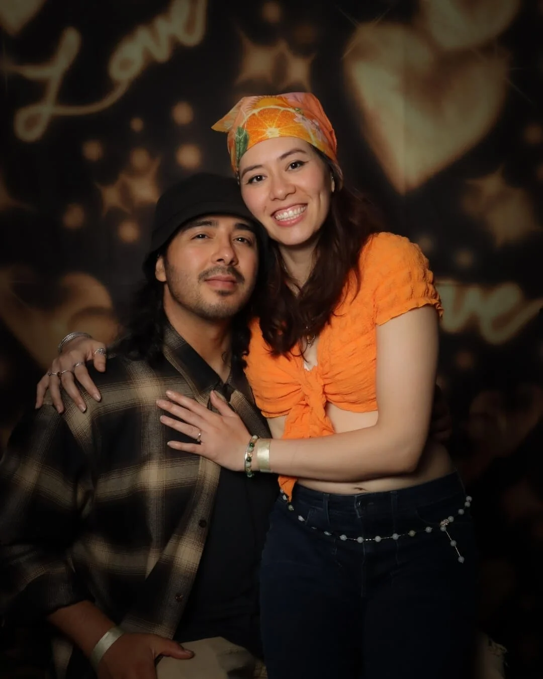 chicano-photobooth-couple-posing.jpeg