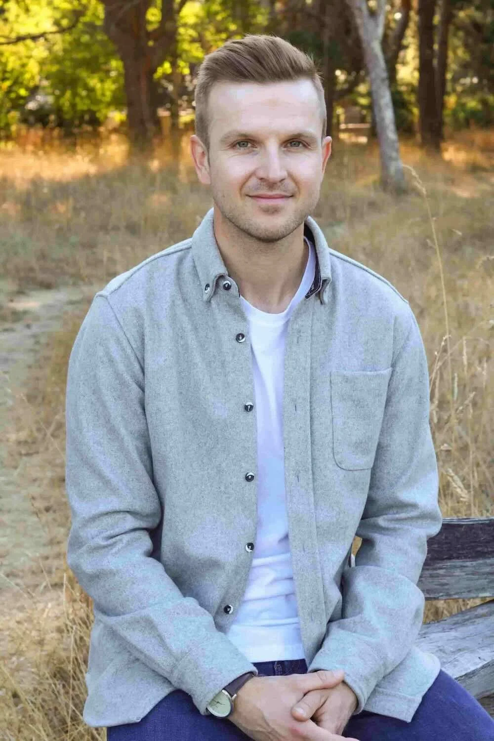 Stephen Thomas, MC, counsellor in Victoria BC, seated outdoors in a portrait photograph.