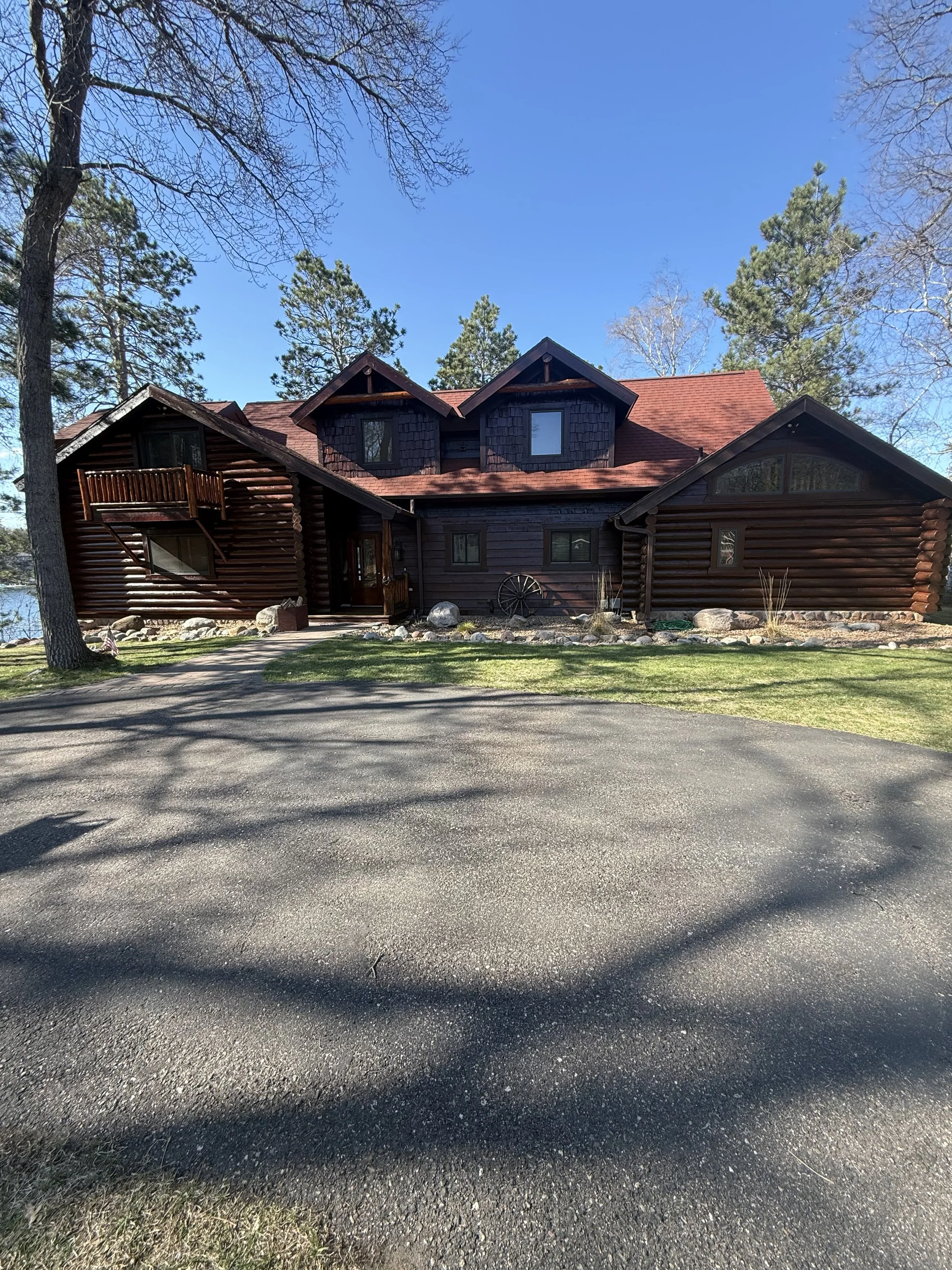 log cabin with dark stain in brainerd lakes area minnesota