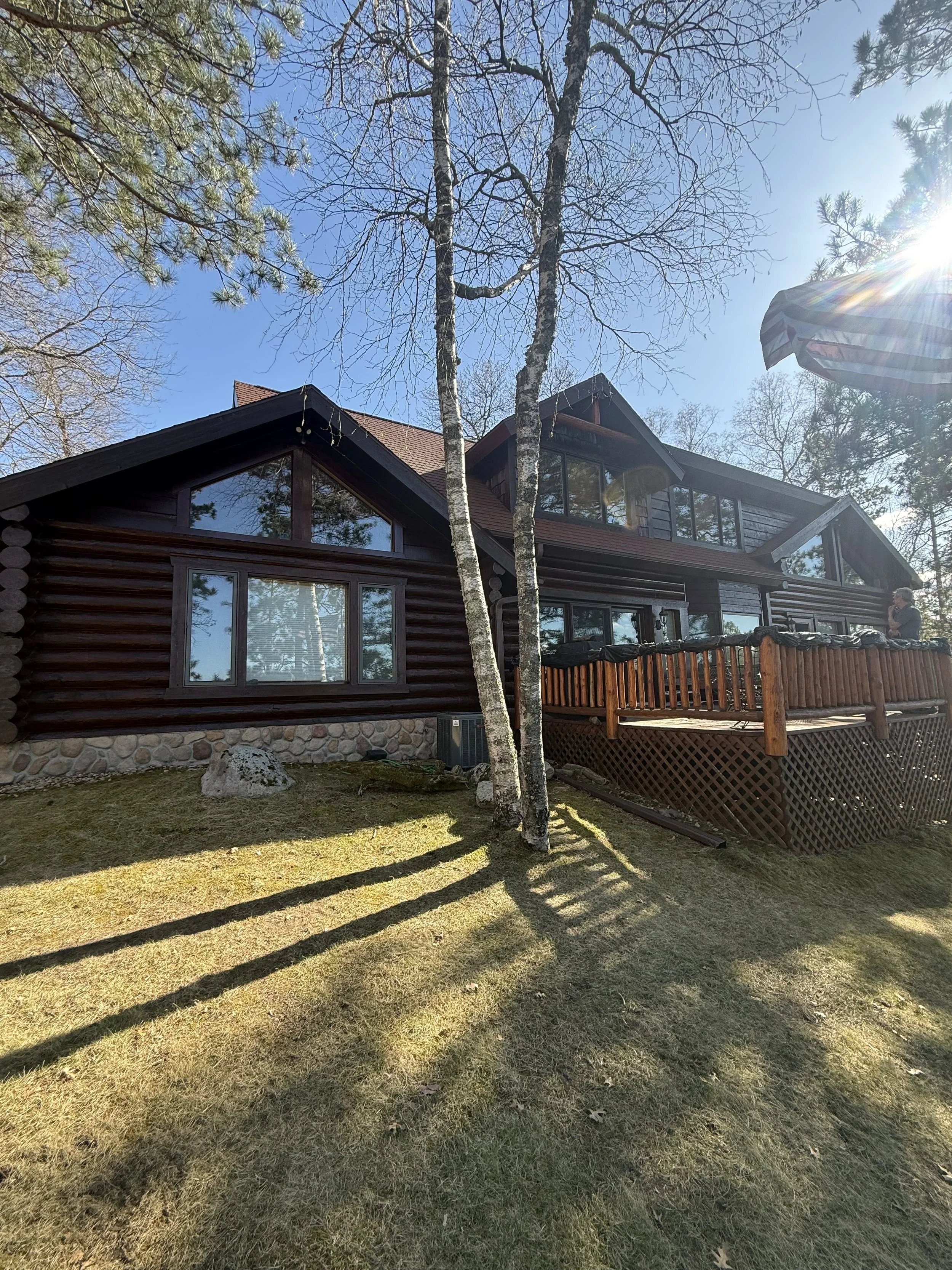 log cabin with dark stain in brainerd lakes area minnesota