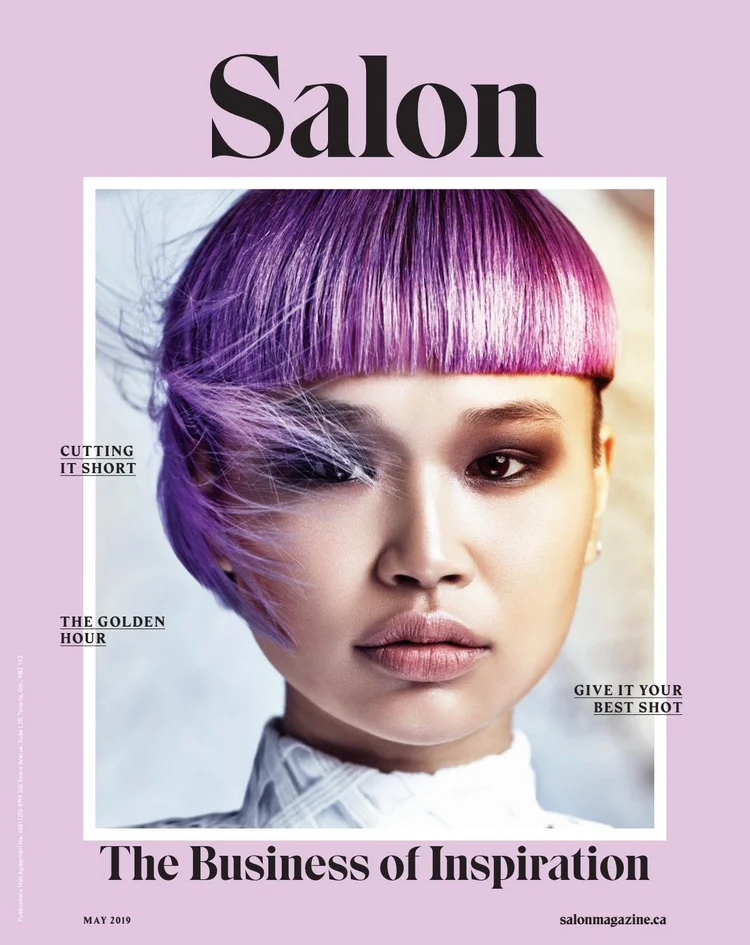 Magazine cover titled "Salon," featuring a woman with short, straight hair dyed in shades of purple and pink, with makeup and a confident expression. Text highlights sections about haircut tips, golden hour photography, and styling advice, with a lavender background and black and white text.
