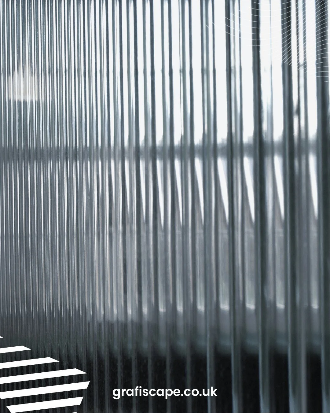 Reeded window film introduces texture and soft visual separation while allowing light to pass through. The vertical pattern distorts views without fully blocking them, making it suitable for glazed partitions in offices and commercial interiors.

Lea