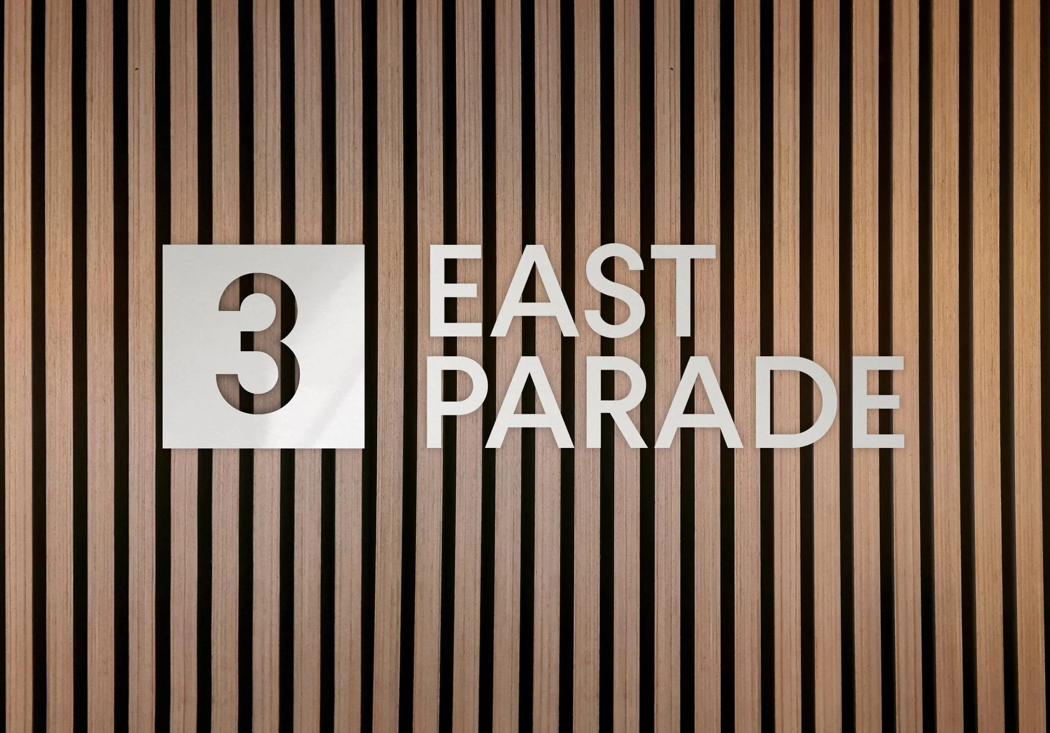 Acrylic lettering on acoustic wall slated panels