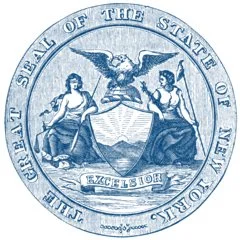 The seal of the state of Utah showing an eagle, two women, and the word 'Utah' with the motto 'Industry'.