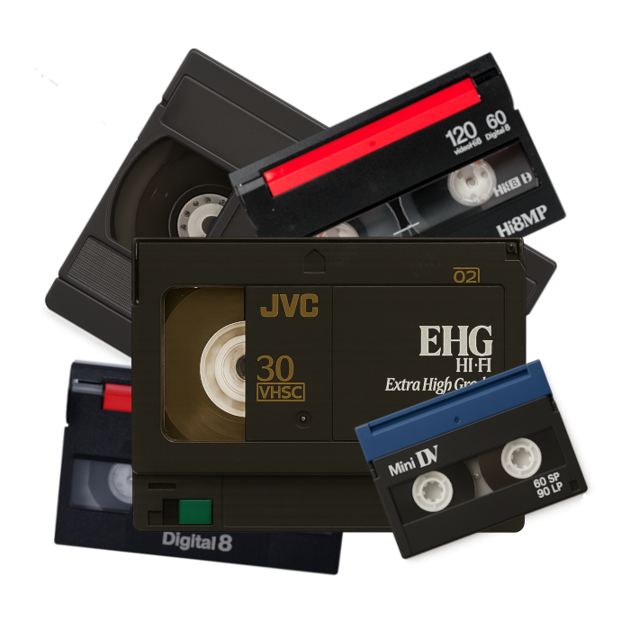 Collection of vintage VHS cassette tapes in various colors and brands, which Coppolo Studios can transfer to digital format.
