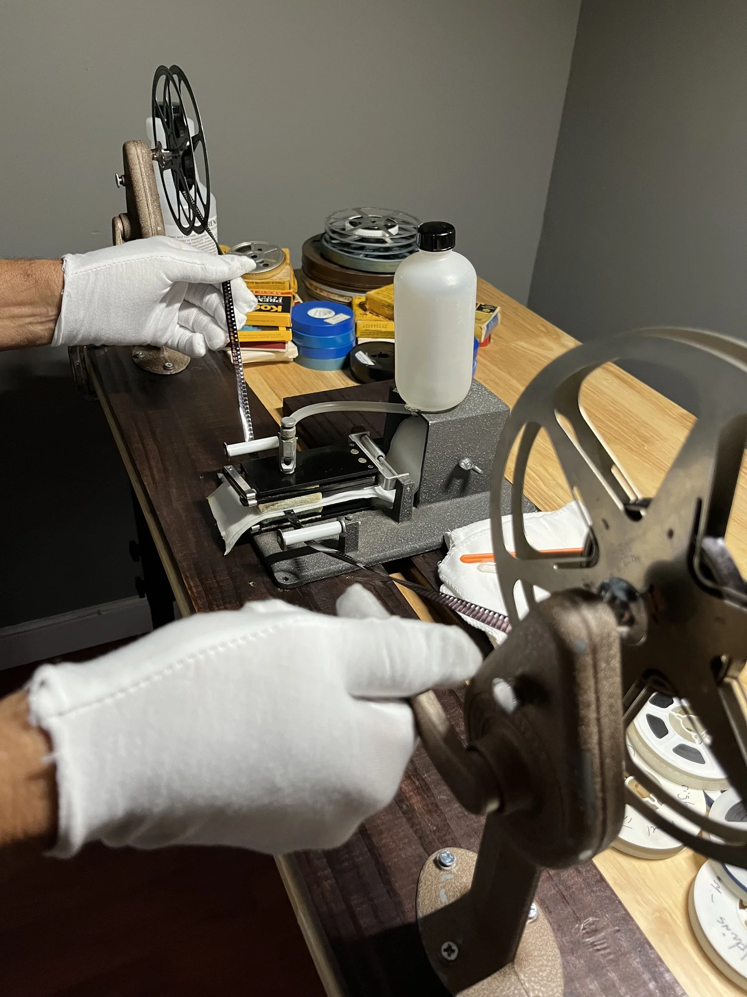 Film being carefully handled and transferred at Coppolo Studios in Miami
