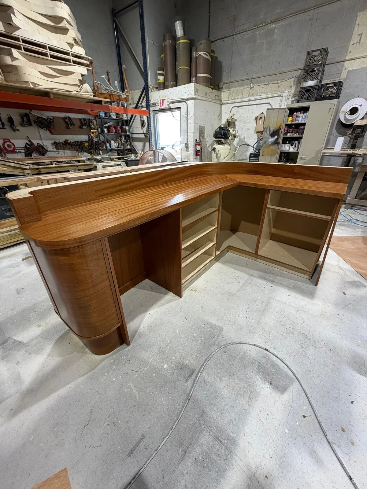 unfinished wooden L-shaped countertop in a workshop