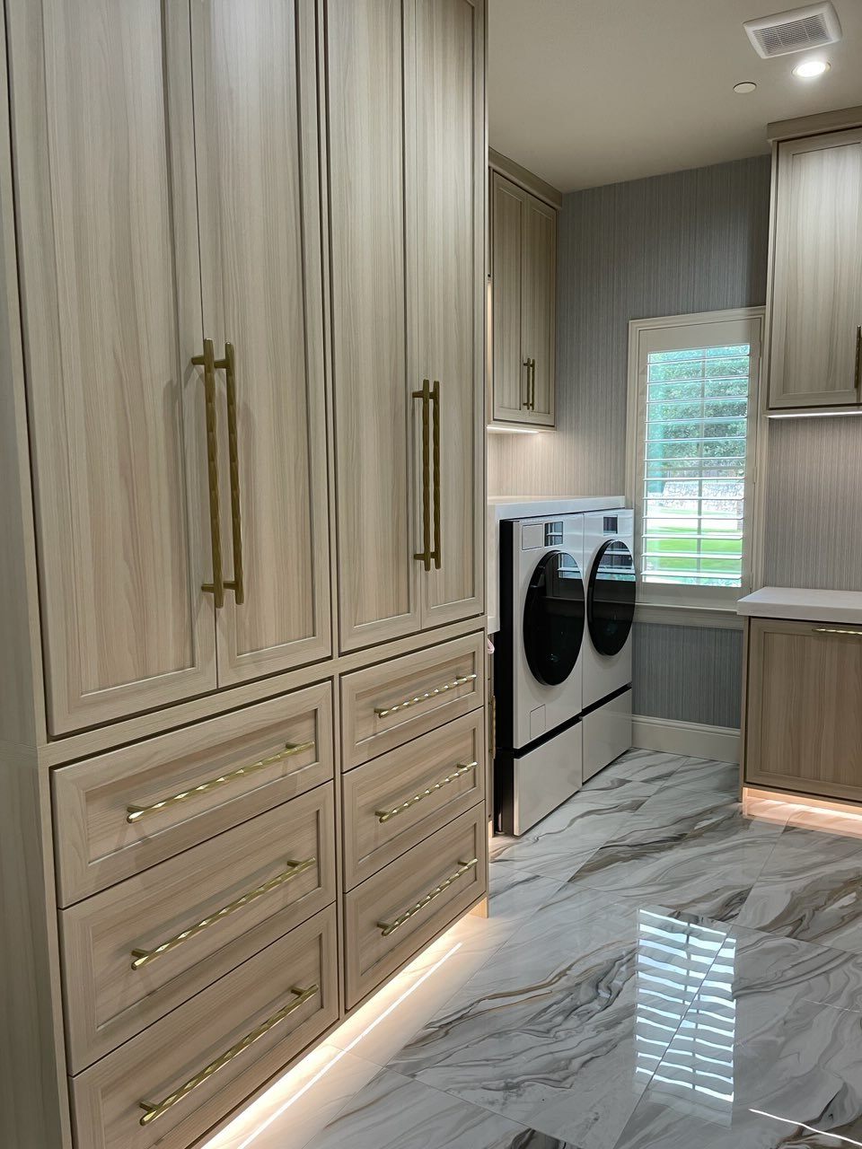 Luxury Custom Laundry Room With Linen Storage