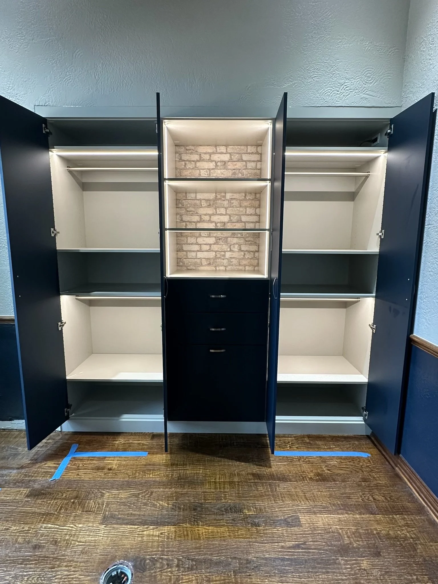 Dark Blue Wardrobe Closet with Custom Lighting