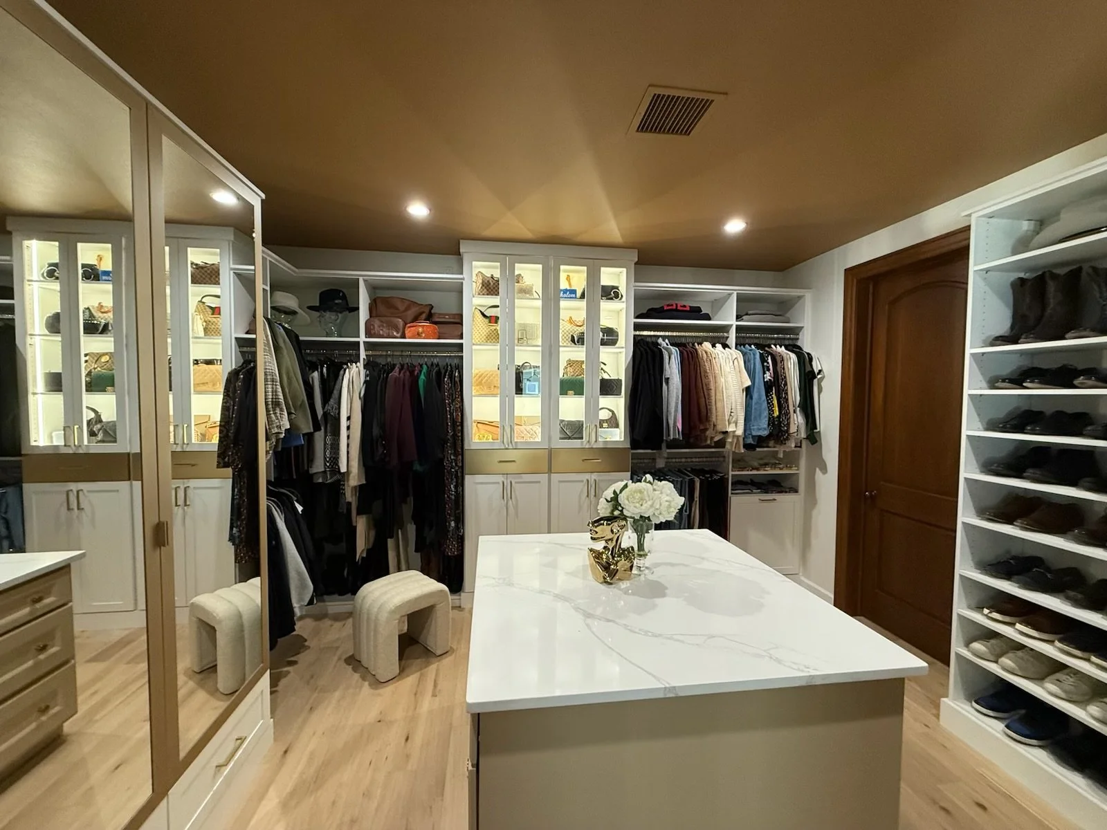 Custom Closet with Glass and Lighting