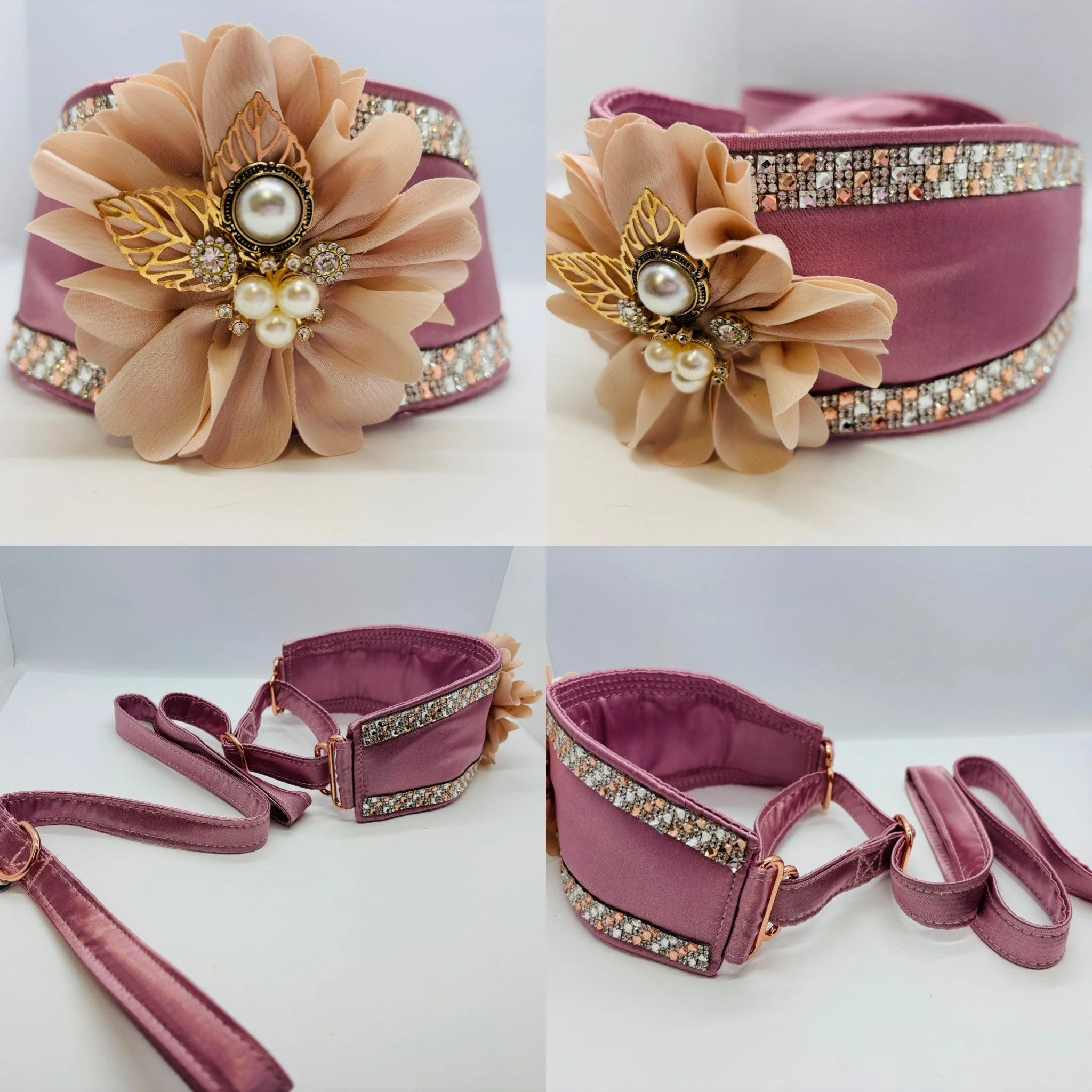 A pink satin dog collar and leash set with a large beige fabric flower and rhinestone embellishments.