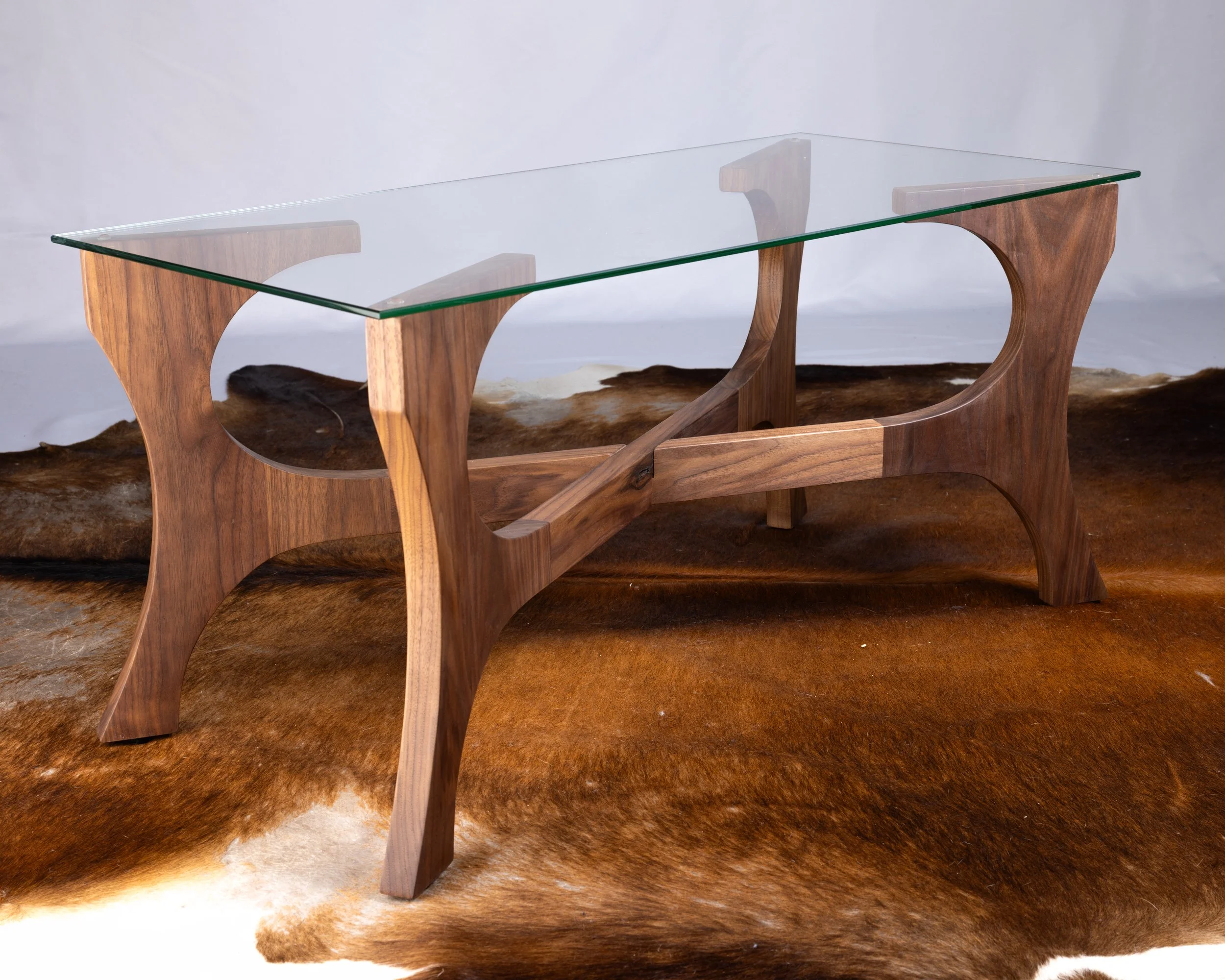 A wooden and glass table.