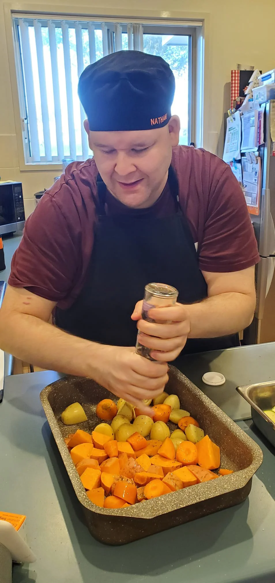 A baking tray with vegetables in it