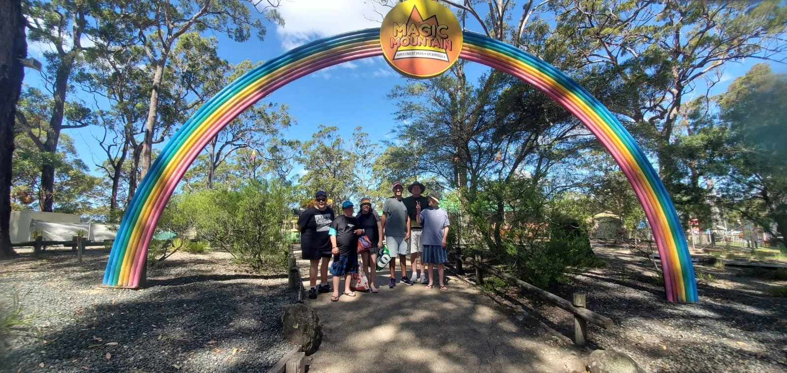 Group of participants outside under a sign that says Magic Mountain