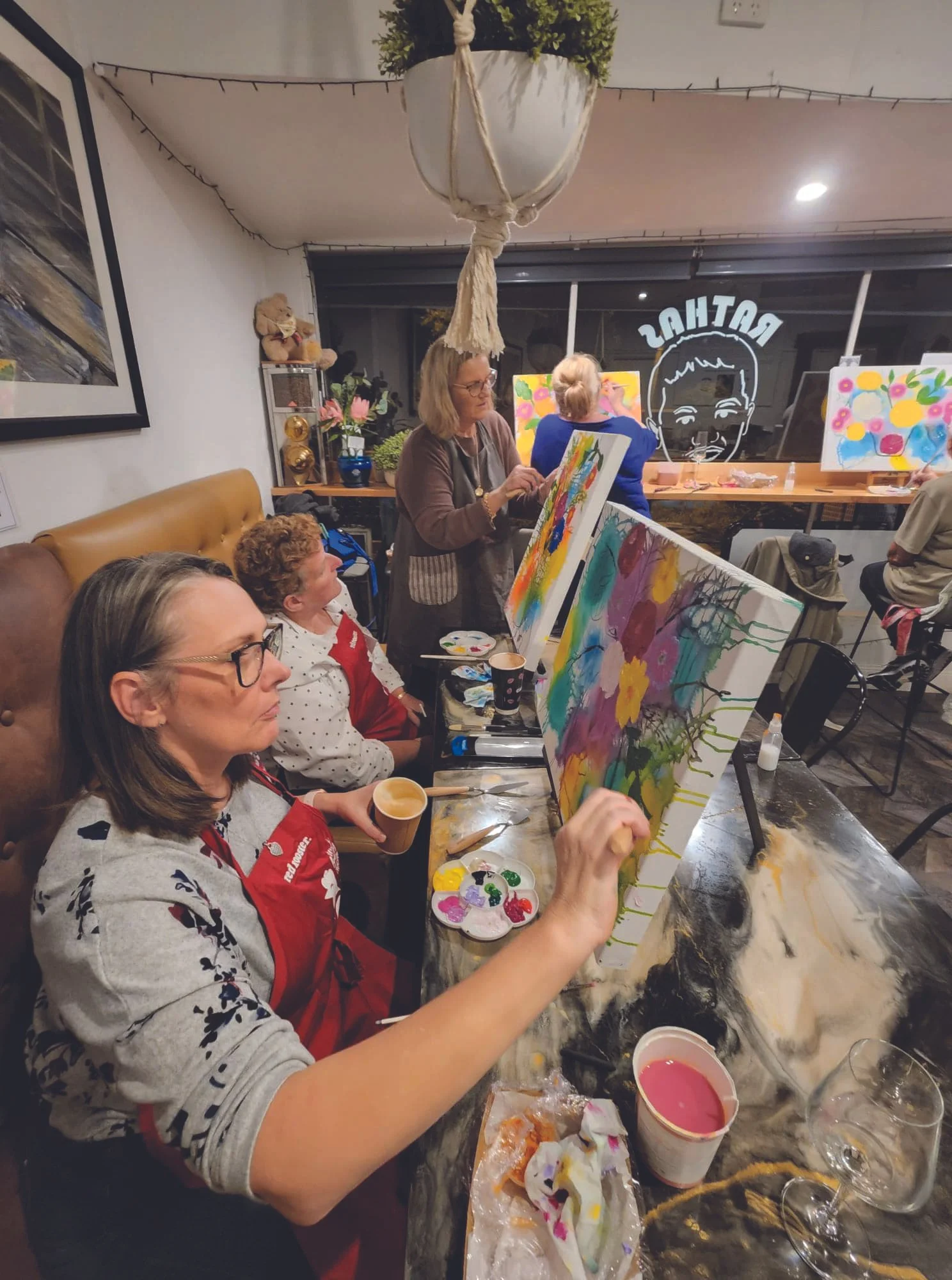Parents and carers at a paint and sip session