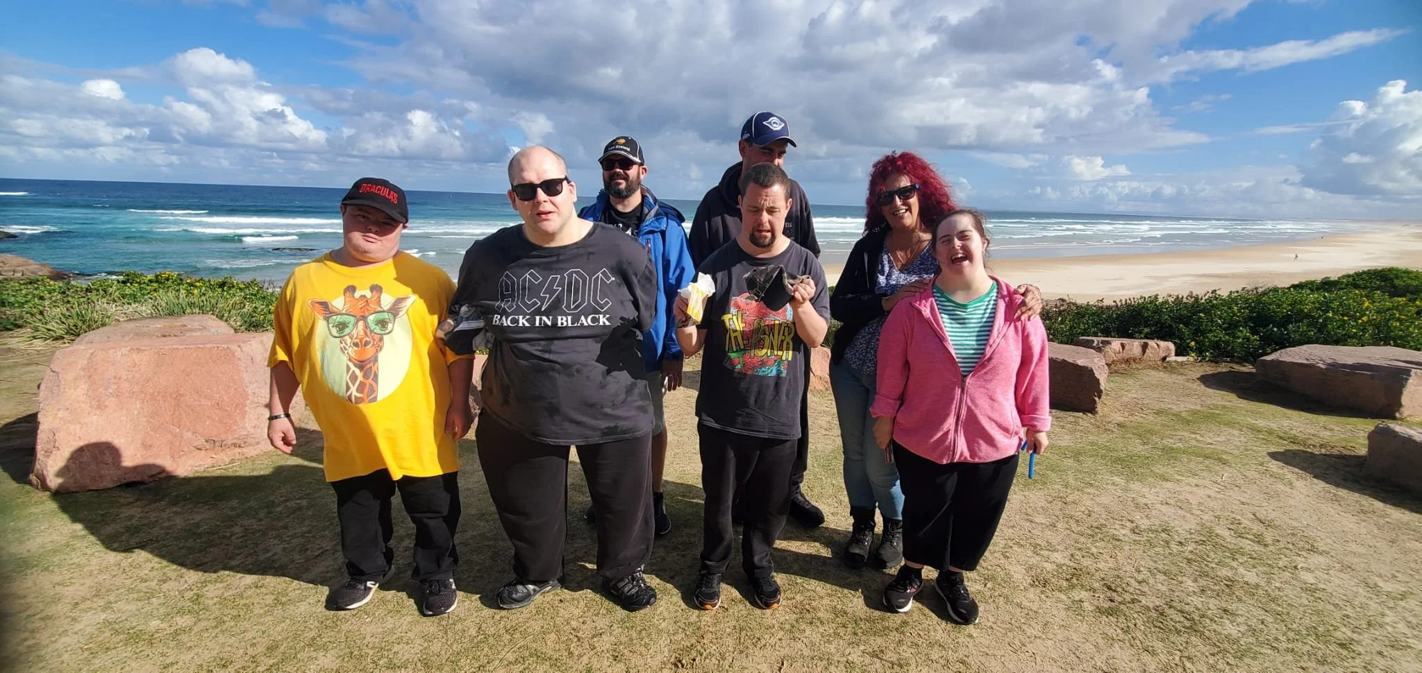 Group of participants standing in front of a beach lookout