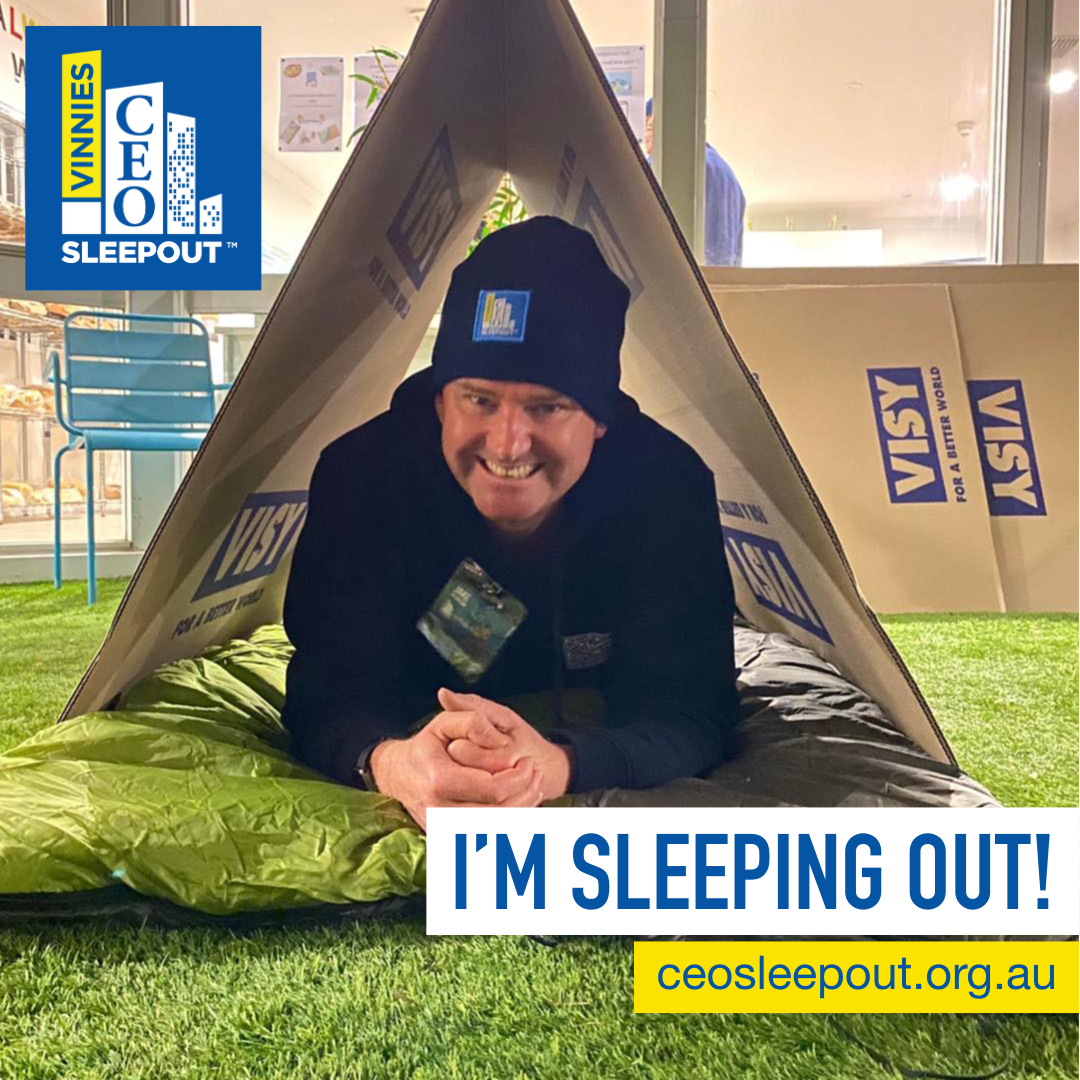 Jake, our CEO, with a sleeping bag under a cardboard structure, ready for the CEO sleepout