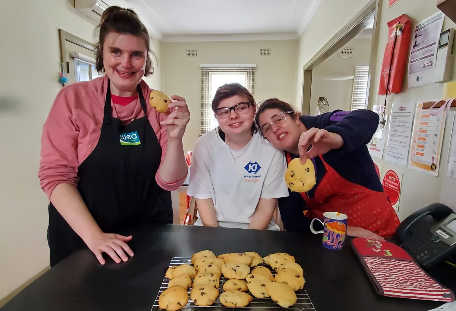 Participants showing the cookies they have made