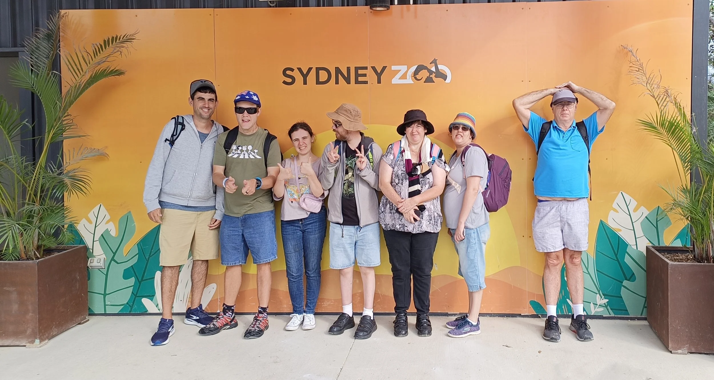 Group of participants standing in front of Sydney Zoo sign
