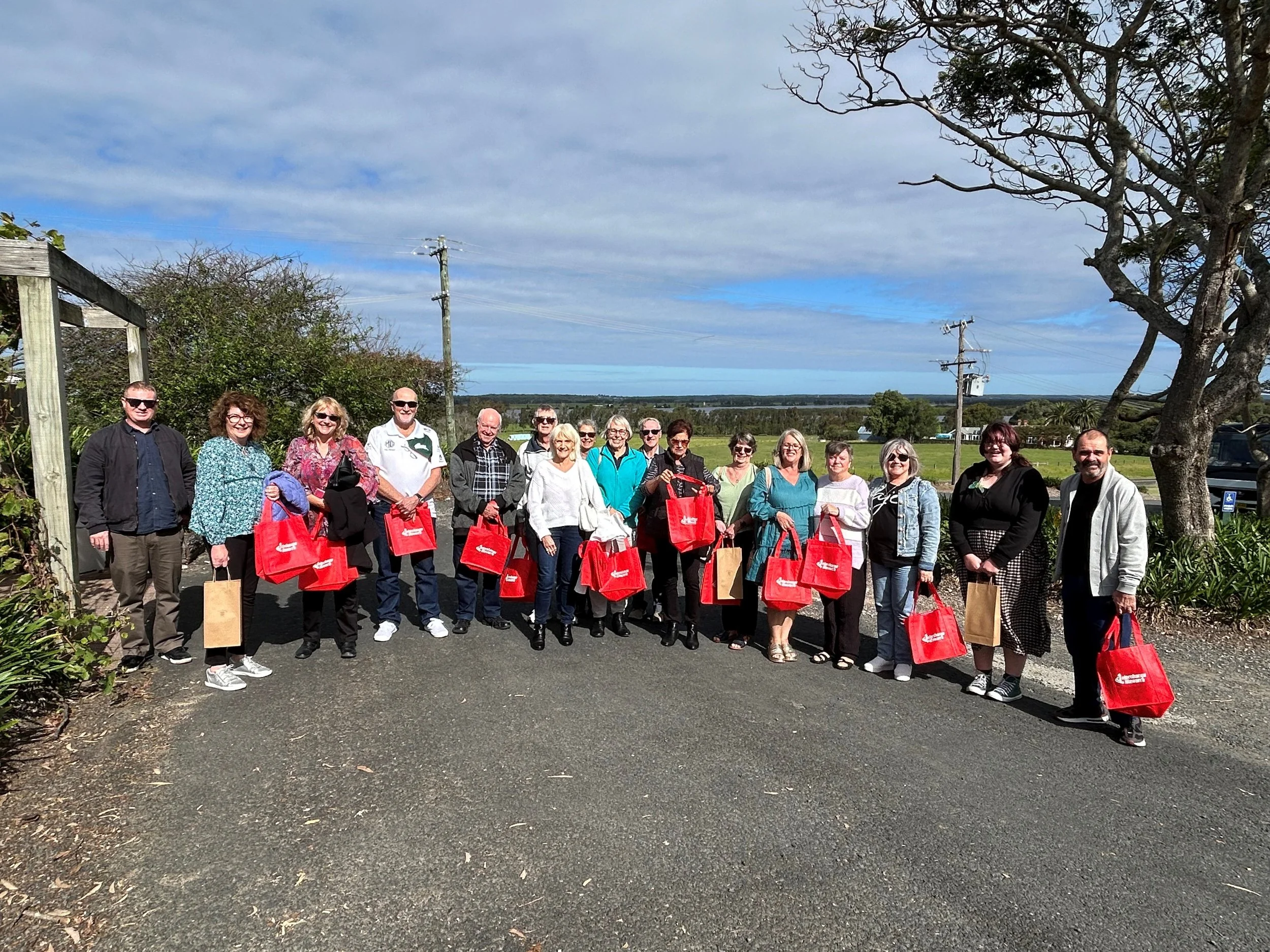 Parents and Carers at an event holding red Interchange bags