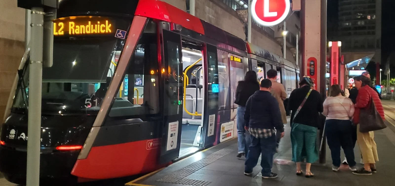 Light rail platform and people in Sydney