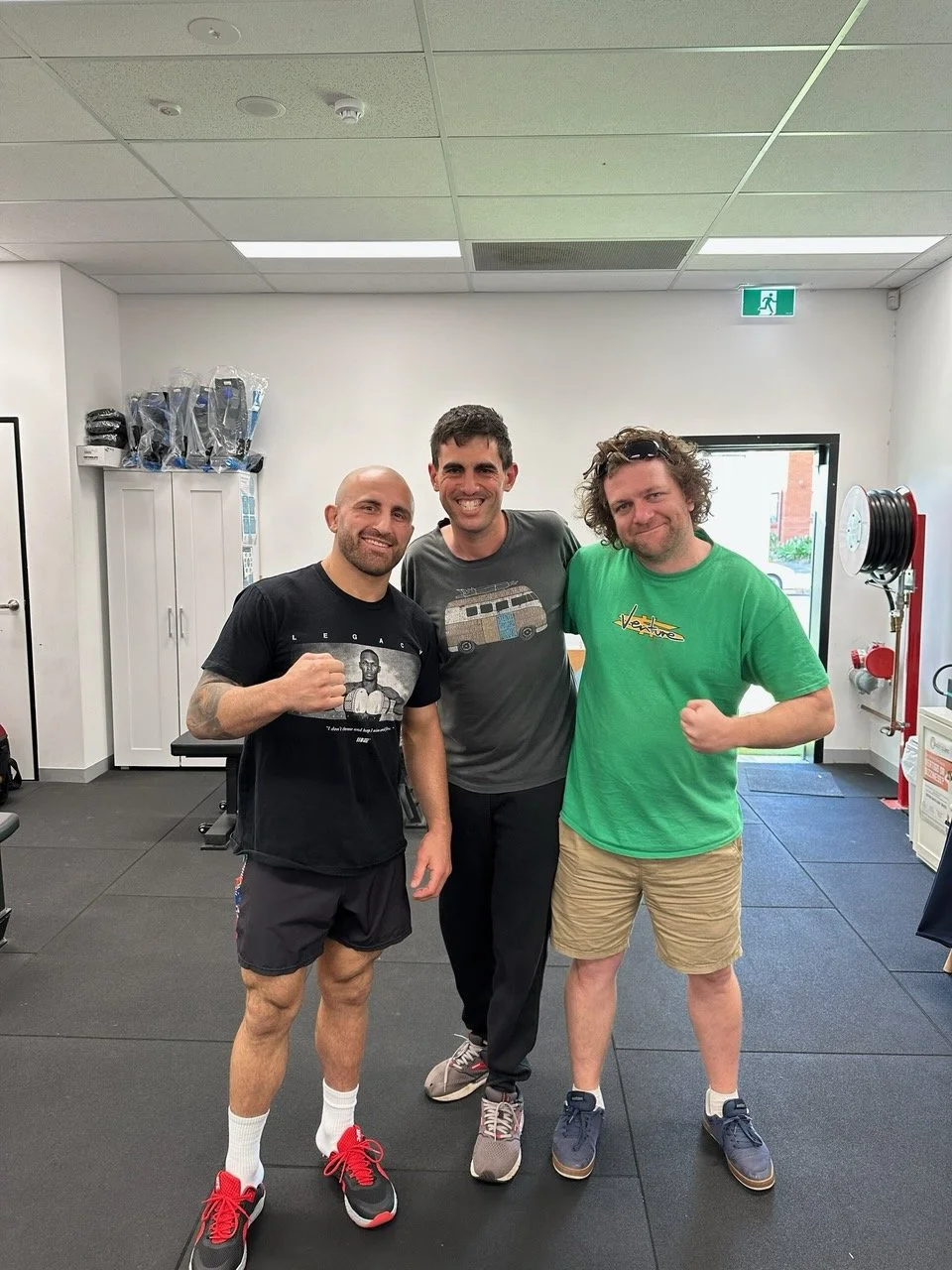 Participant at the gym with Support Worker and Alexander Volkanovski