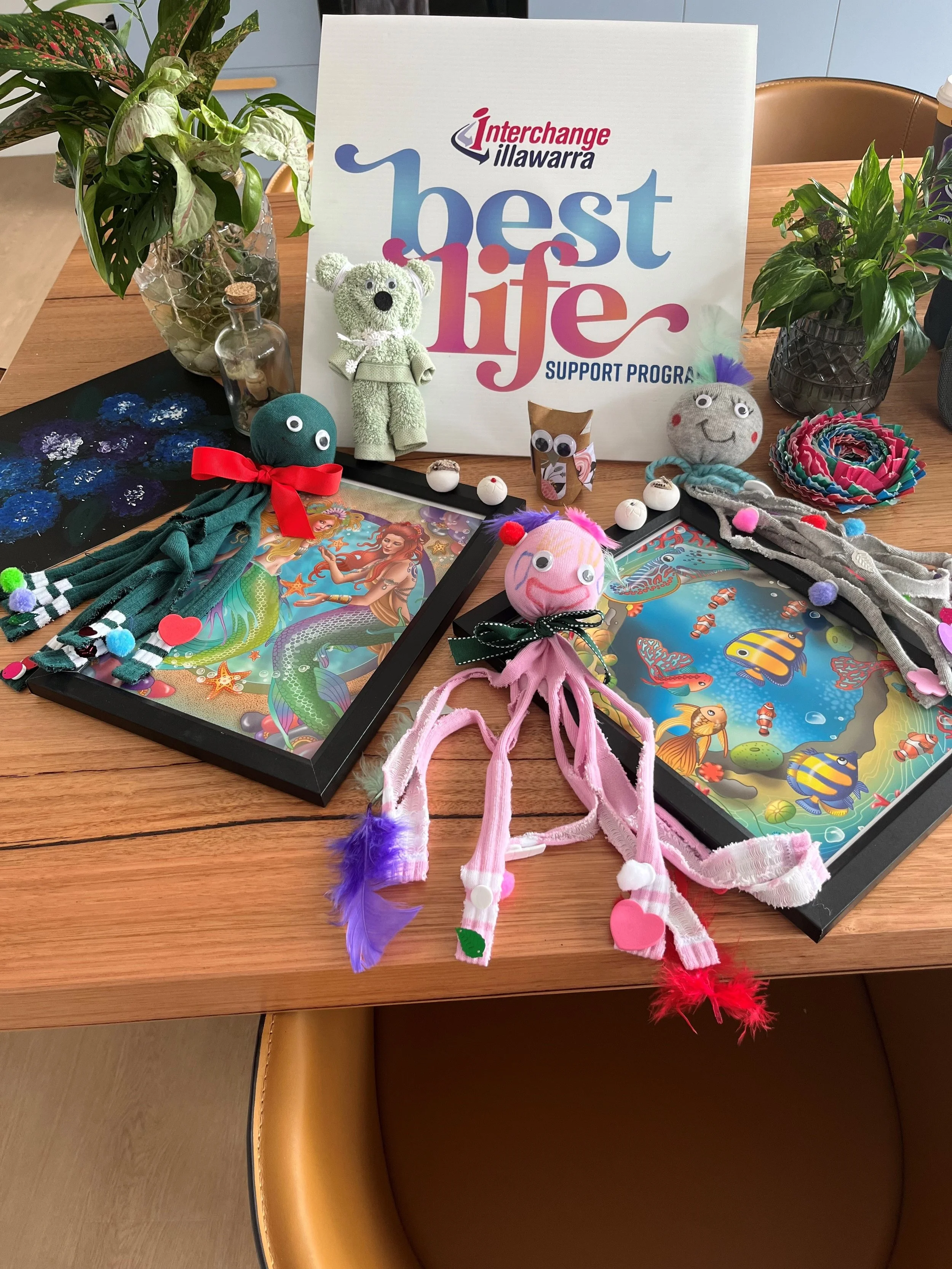 Assortment of crafts with a BestLife sign in the background