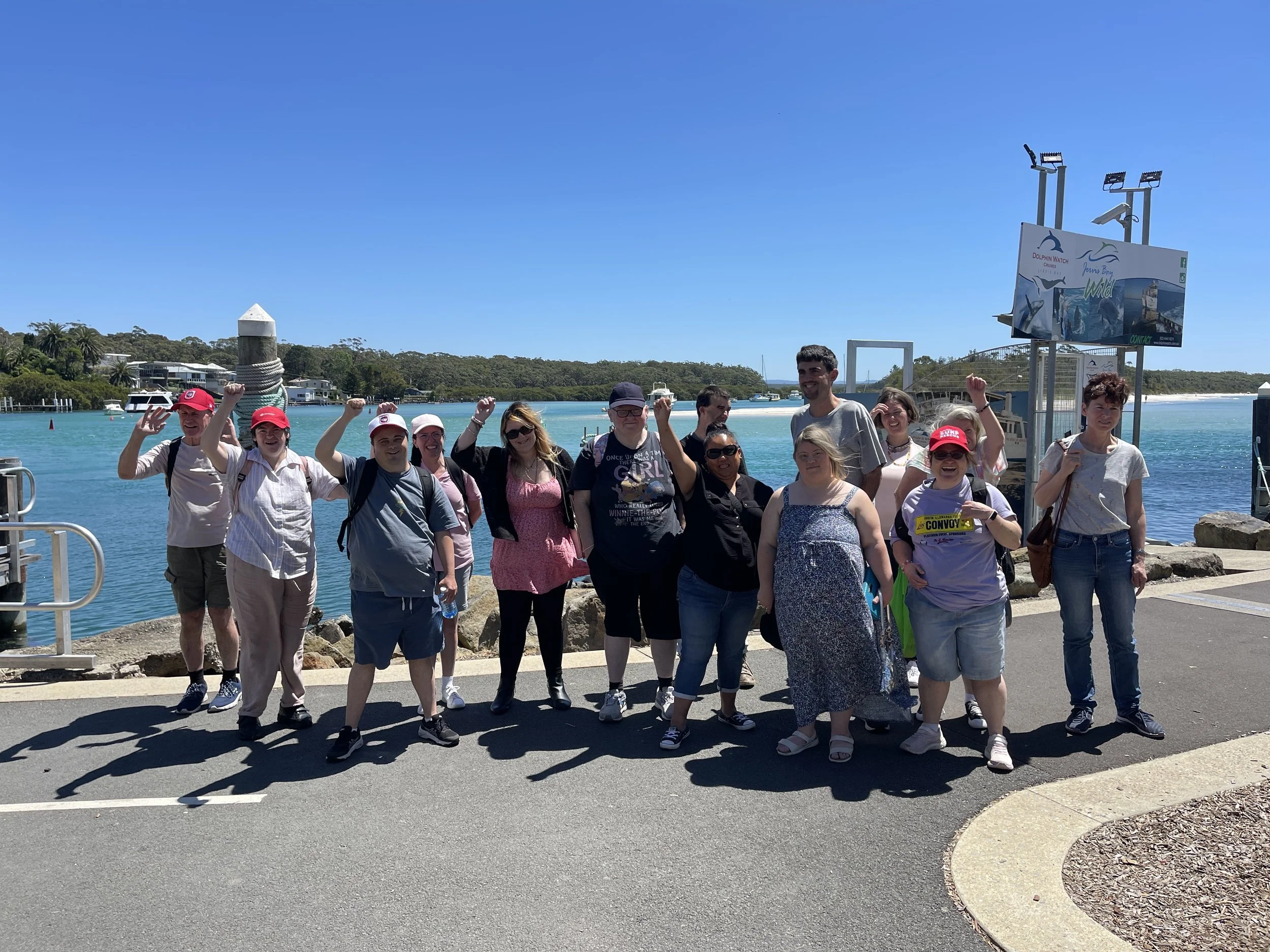 A group of participants looking happy next to the water at Huskisson