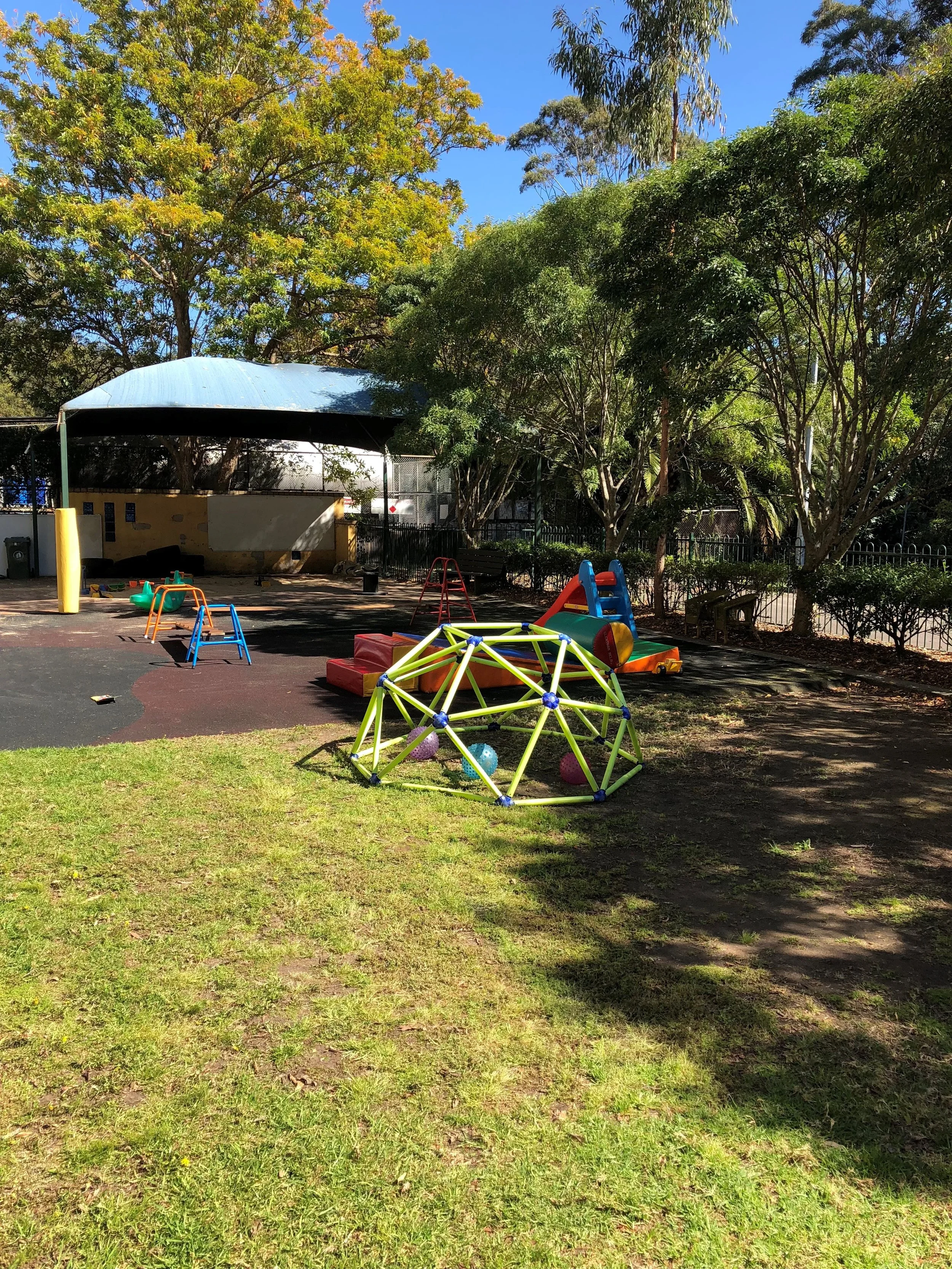 An outdoor space with childrens play activites set up