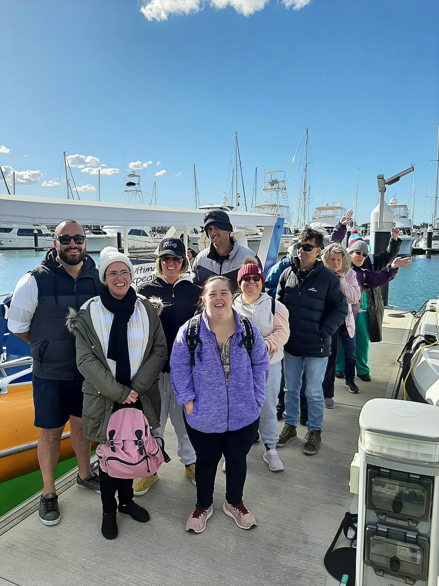 Group of participants on a wharf before whale watching